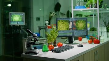 Empty microbiology laboratory with nobody in it prepared for genetic mutation analysis using hight tech tools. Interior of lab is equipped with microscope, test tubes ready for medical experiment photo