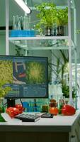 Empty laboratory with nobody in it prepared for genetic test using professional microscope. Biochemistry lab eqquiped with high tech tools for pharmaceutical plant GMO biology medical research test photo