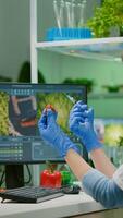Scientist injecting strawberry with pesticides discovery genetic mutation of fruits for organic experiment. Biochemist working in pharmaceutical laboratory testing health food for medical expertise photo