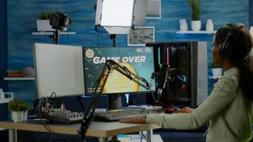 Disappointed african online game streamer losing championship, internet multiplayers. Professional gamer streaming online games with new graphics on powerful computer. photo