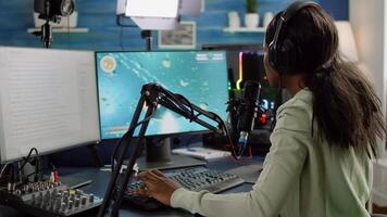 Nevous black streamer losing videogame, game over for african woman cyber playing online space shooter games with headset. Player performing on powerful computer talking with players on stream chat photo