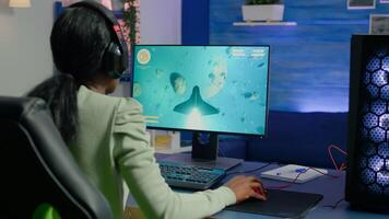 Upset professional african streamer losing game during virtual gaming tournament playing from gaming home studio on RGB powerful computer. Cyber gamer performing at online esport championship photo