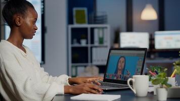 Black woman photo retoucher working on laptop at new project in business office overtime. Content creator doing portrait retouching, artist, occupation, screen, graphic late at night