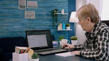 Middle aged woman engineer working with architectural plans, cad software on laptop computer. Designer using digital arhitecture blueprints of buildings working overtime, creating and studying photo