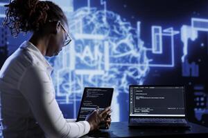Tech support updates neural networks made of interconnected nodes, writing intricate binary code scripts on tablet and laptop. Server hub employee uses programming to upgrade AI simulation model photo