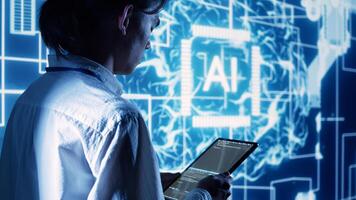 Supervisor overseeing programming scripts on tablet, developing AI machine learning tools. Inspector checking lines of code for artificial intelligence applications development photo