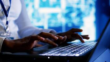 Trained specialist using laptop to maintenance artificial intelligence neural networks made up of artificial neurons. System administrator using AI system aiding in processing information, close up photo