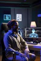 Computer engineer entering trance, receiving commands from artificial intelligence entity overlord. Unconscious programmer getting controlled by AI robot gaining superintelligence photo