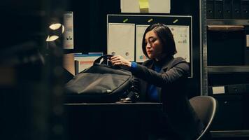 Private agent initiates background checks on individuals associated with archived cases to gather relevant information. After reading legal statements, leaving for field work. Camera B. photo