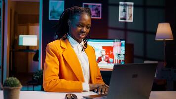 University student attending online courses on e learning software, discussing with tutor and classmates about group project tasks. Girl watching recorded lectures or educational videos. Camera B. photo