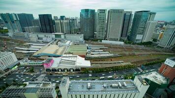 A timelapse of panoramic view in front of the station in Tokyo cloudy wide shot video