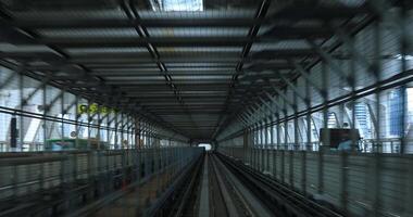 A back point of view on the railway at Yurikamome line in Tokyo video