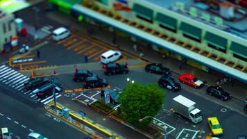 A timelapse of high angle view in front of the station in Tokyo daytime cloudy sky tilt shift video