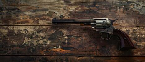Old Western Revolver on Rustic Wooden Tabletop photo