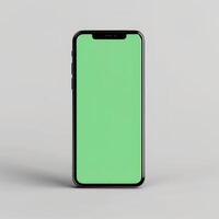 mobile phone with green screen on a gray background. Phone mockup photo