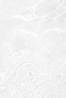 Close-up of Calm White Water with Ripples and Bubbles photo