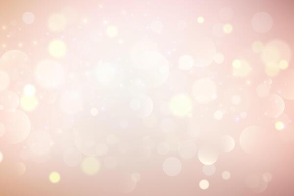 Light background with bokeh. Abstract golden glitter texture. Beige gradient with glow. Ivory pastel blurred backdrop for wedding invitation design. Nude elegant gradation wallpaper