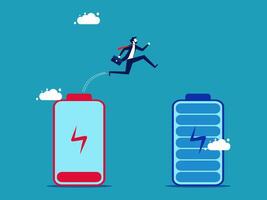businessman jumping over two batteries with a cloud in the background vector