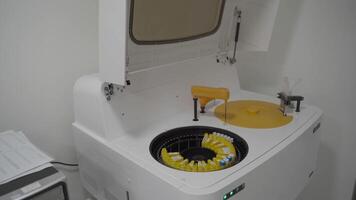 Hospital laboratories, automatic biochemical analyzer. Auto sampler, scientific Instrument, science Laboratory. Round automated device for medical tests in a modern hospital. Robotic tool in medicine video