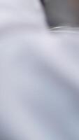 Add flour to. woman's hand mixes the dough with the added flour with a spoon. Making pastries at home. video