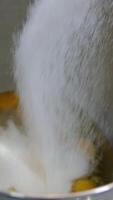 Sugar and eggs Chicken eggs are mixed with sugar in a mixer. Confectionery production. Concept of cakes and pastries video