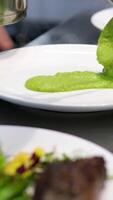 Puree mashed potatoes with green pea in bowl on wooden table. grilled salmon with mashed peas, Salmon steak, Red fish piece with green pea puree. healthy meal close up video