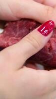 Beef tenderloin Raw beef steak cut on a wooden board, slow motion video