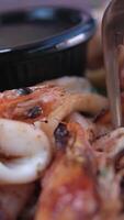 Dip the squid into the sauce. Boiled squid and soy sauce video