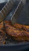 Fry salmon in a frying pan Salmon steak is cooked in a frying pan in close-up. Red trout fish for healthy proper nutrition. video