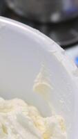 Ganache with Camembert cheese and pears Woman holding raspberry bento cake stuffed with whipped cream. Confectionery, baking and cooking concept woman making cake. process of creating video