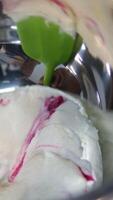 Ganache with Camembert cheese and pears Woman holding raspberry bento cake stuffed with whipped cream. Confectionery, baking and cooking concept woman making cake. process of creating video