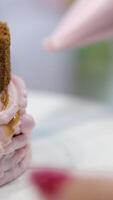 Ganache with Camembert cheese and pears Woman holding raspberry bento cake stuffed with whipped cream. Confectionery, baking and cooking concept woman making cake. process of creating video