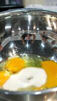 Eggs and sugar Preparing to make sweet tamagoyaki. A of adding sugar to raw eggs and mixing them. video