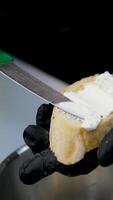 Spread cream cheese on bread Spreading cream cheese On Bread with knife, close up video