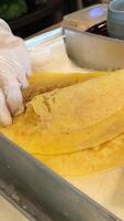 Spread cream on thin pancakes Spread thin pancakes with chocolate or cream paste. Pancakes with boiled condensed milk and banana filling video