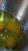 break eggs Chicken eggs broken and poured into a dish or pan. Cook in the kitchen breaks colitis egg shell, Whisking eggs to make pastry dough, Egg yolk falls into a glass bowl bowl video
