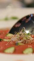 tomato soup Stirring tomato soup with bread roll flat lay medium slow motion shot selective focus video