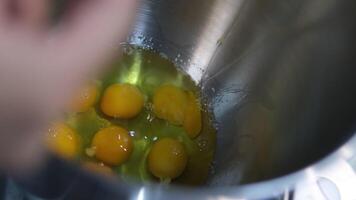 break eggs Chicken eggs broken and poured into a dish or pan. Cook in the kitchen breaks colitis egg shell, Whisking eggs to make pastry dough, Egg yolk falls into a glass bowl bowl video