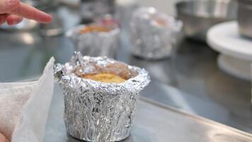 ready-made baked goods. make easter bread and bento cake Check the dough's readiness with your finger. female cook touching softness of dough after baking in homemade foil form video