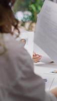 Vertical Human resources staff evaluating candidates resume in the selection process, reviewing all applicants after job interview in order to hire the right person. Recruiters seeking personnel. Camera A. video