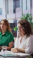 Vertical HR manager discussing with the last two remaining job candidates, having to make a choice and hire the most suitable person for the job opening. Recruiter works on selection process. Camera B. video