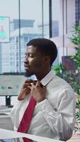 Vertical Anxious inexperienced job applicant feeling very uncomfortable during interview, being insecure and overwhelmed while he talks about himself and his qualifications with the HR team. Camera B. video