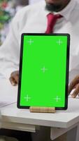Vertical Interviewer and candidate meeting for an interview next to green screen, HR manager asking questions about qualifications and business administration expertise. Recruitment process. Camera A. video