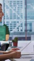 Vertical In a professional interview setting, job seeker presents detailed CV to an HR recruiter. Businesswoman interviewing an applicant, explores potential career development opportunities. Camera A. video