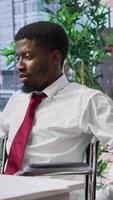 Vertical Job applicant in a wheelchair participate at interview with HR team, company advocating for workforce equality and inclusion. Job seeker applying for a position within a corporation. Camera A. video