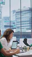 Vertical Team of recruiters talking to job applicant walking in crutches, evaluating resume and discussing his professional background. HR staff looking to hire personnel with professionalism. Camera B. video