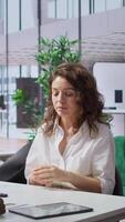 Vertical HR expert discussing with a skilled job candidate during interview, looking for personnel to fill in job opening in a multinational company. Businesswoman applying for job offer. Camera B. video