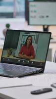 Vertical Human resources worker conducting a job interview via online videocall, using remote internet telecommunication to look for talented personnel. Employee interviewing woman on conference. Camera A. video