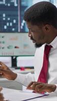 Vertical New employee signing his work contract after successful job interview with the HR staff, businesswomen shaking hands and welcoming man to the team. Job applicant securing a position. Camera A. video