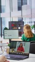 Vertical Human resources worker conducting a job interview via online videocall, using remote internet telecommunication to look for talented personnel. Employee interviewing woman on conference. Camera B. video